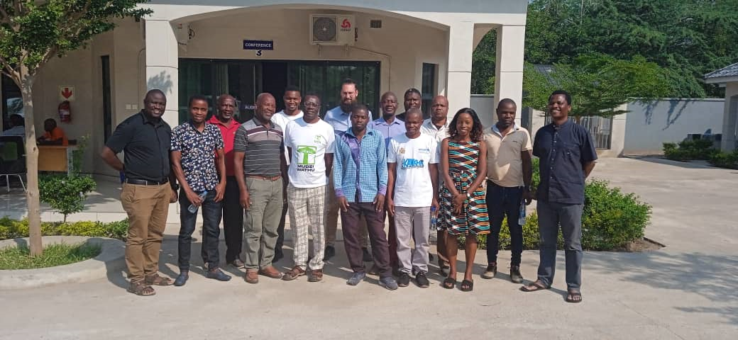 All We Can Partners that went through the PVCA training in a group photo with James Kalikwembe (far right) and Peter Blanch (9th from right) from All We Can